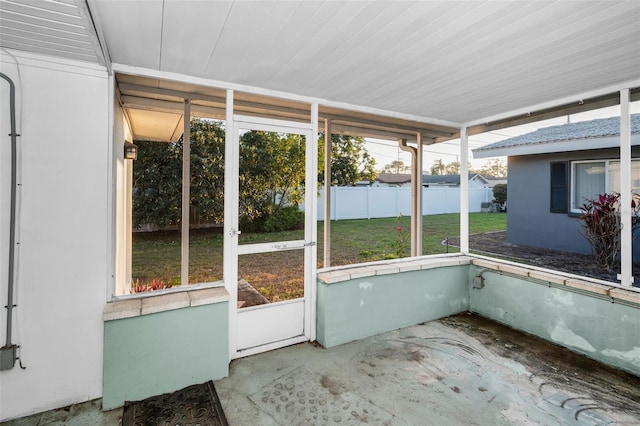 unfurnished sunroom featuring plenty of natural light