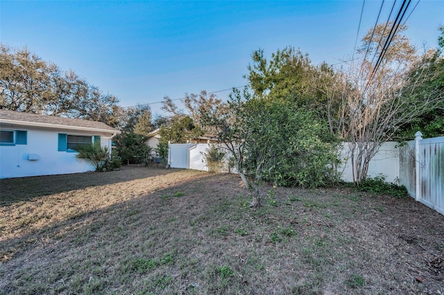 view of yard with a fenced backyard