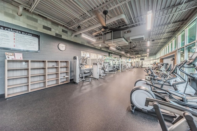 gym featuring concrete block wall