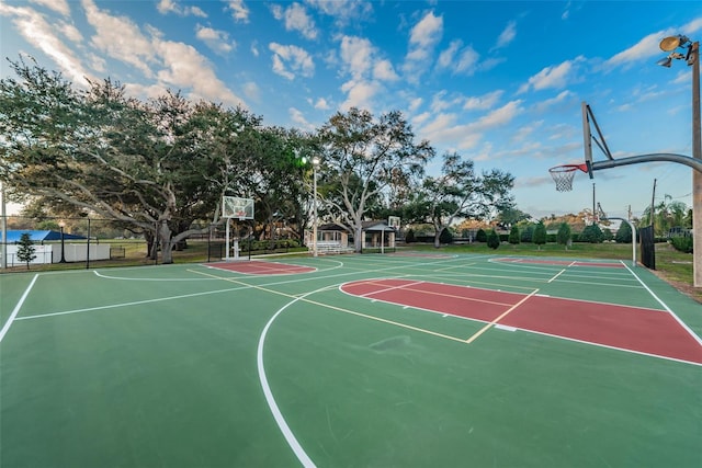 view of basketball court featuring community basketball court and fence