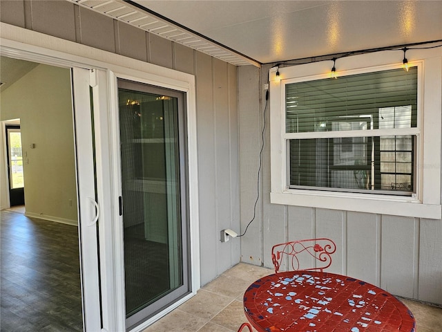 exterior space featuring outdoor dining area and board and batten siding