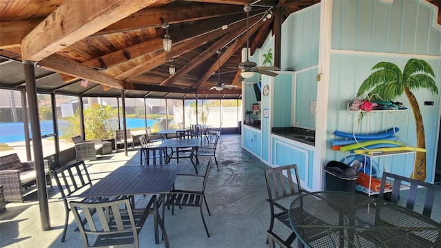 sunroom / solarium with vaulted ceiling with beams and wood ceiling