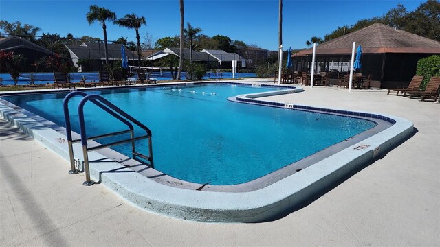 pool with a patio area