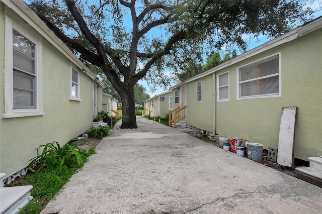 view of home's exterior featuring a residential view and stucco siding