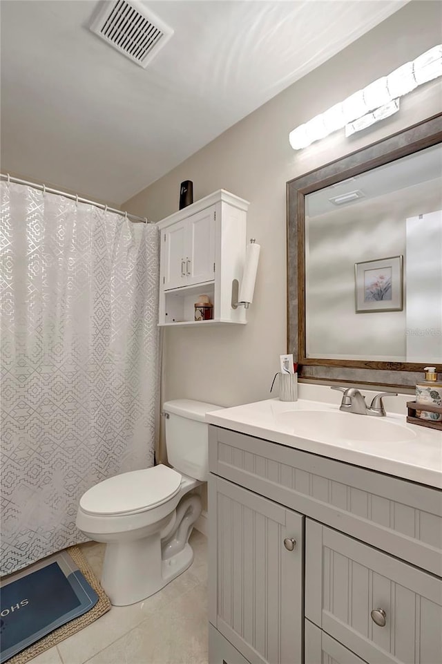 bathroom with toilet, a shower with shower curtain, vanity, visible vents, and tile patterned floors