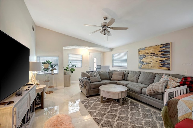 living area featuring lofted ceiling, baseboards, visible vents, and a ceiling fan