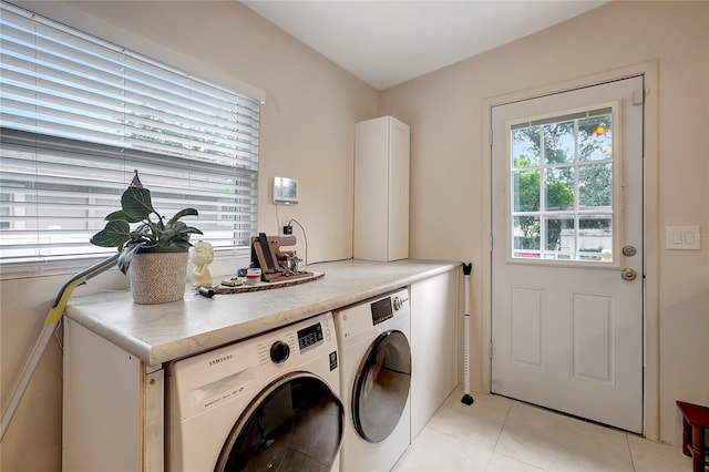 clothes washing area with laundry area, light tile patterned flooring, and separate washer and dryer