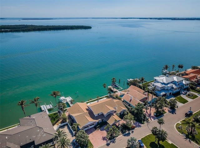 birds eye view of property with a water view and a residential view