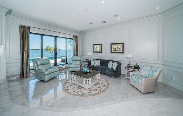 living area with marble finish floor, visible vents, a decorative wall, and crown molding