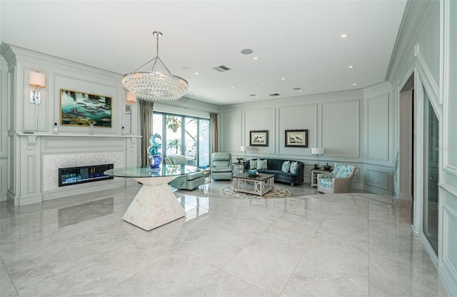 living area with marble finish floor, a premium fireplace, visible vents, and a decorative wall