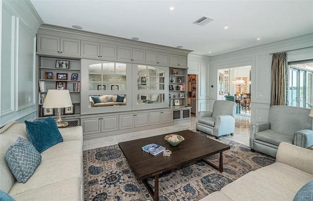 living room featuring built in features, visible vents, crown molding, a decorative wall, and recessed lighting