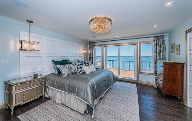 bedroom with dark wood-style floors, recessed lighting, a chandelier, access to outside, and baseboards