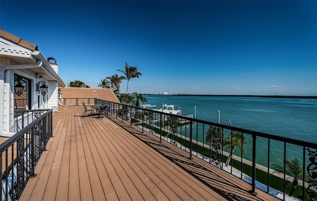 wooden deck with a water view