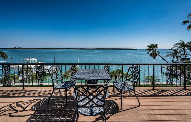 balcony featuring a water view