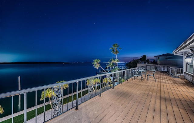 wooden terrace with a water view