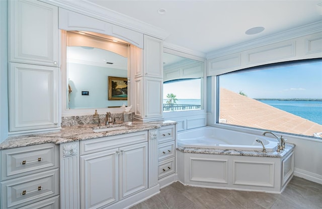 full bath featuring ornamental molding, a water view, vanity, and a bath