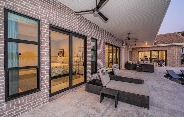 view of patio with a ceiling fan and an outdoor living space