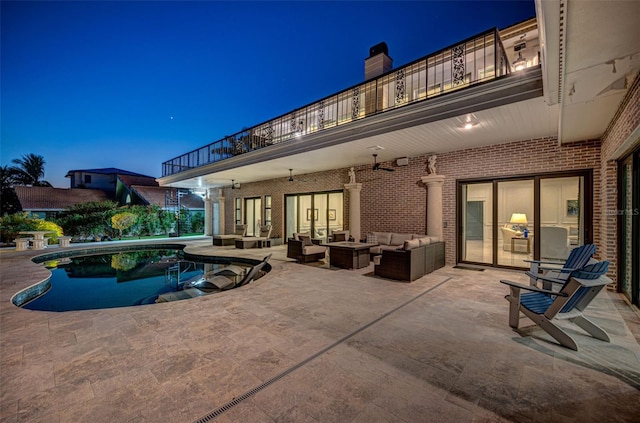 exterior space with an outdoor hangout area and a patio area