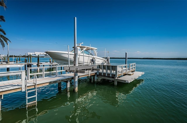 dock area featuring a water view and boat lift