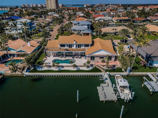 aerial view with a water view and a residential view