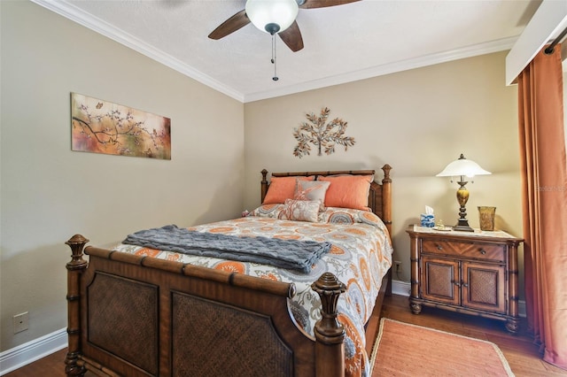 bedroom featuring baseboards, ceiling fan, wood finished floors, and crown molding