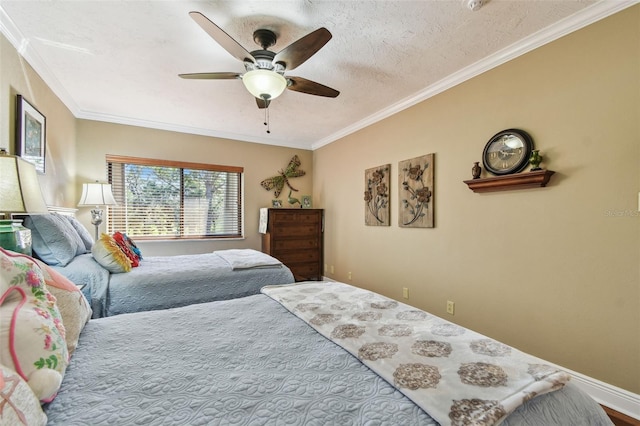 bedroom featuring ornamental molding, a textured ceiling, and a ceiling fan