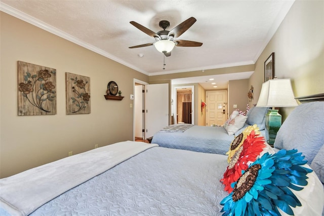 bedroom featuring ornamental molding and a ceiling fan