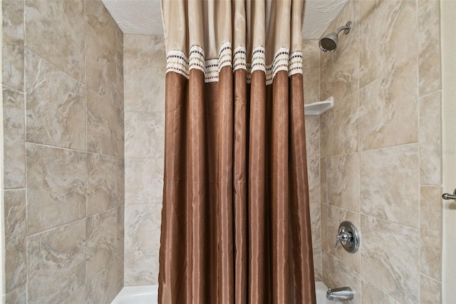 details featuring shower / bath combo