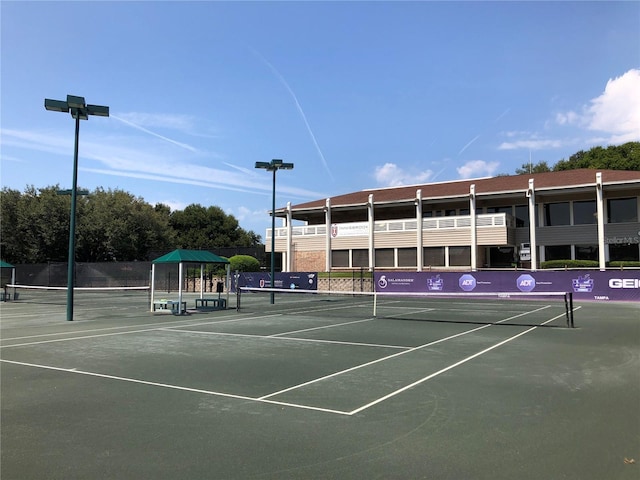 view of sport court with fence