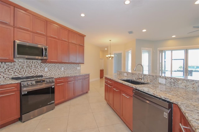 kitchen featuring stainless steel appliances, recessed lighting, decorative backsplash, light tile patterned flooring, and a sink