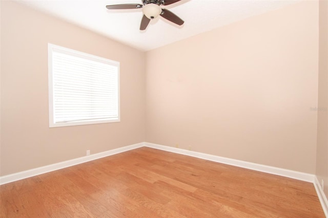 unfurnished room featuring light wood finished floors, a ceiling fan, and baseboards