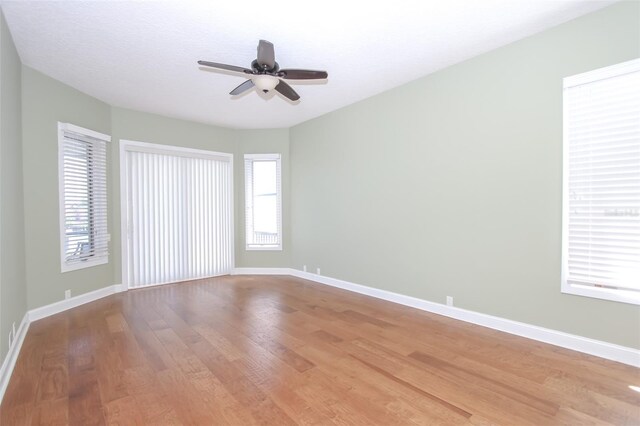 unfurnished room featuring light wood-type flooring and baseboards