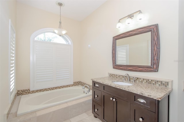 bathroom featuring vanity and a bath