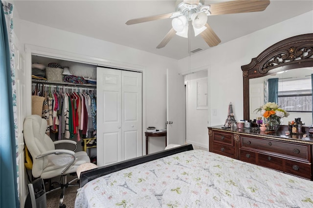 bedroom with a closet, visible vents, and ceiling fan