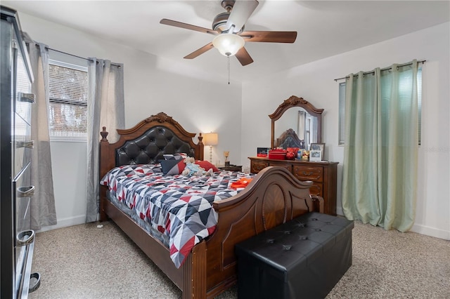 bedroom with baseboards and a ceiling fan