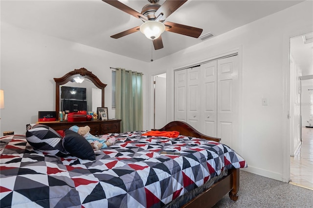 carpeted bedroom with baseboards, a closet, visible vents, and a ceiling fan