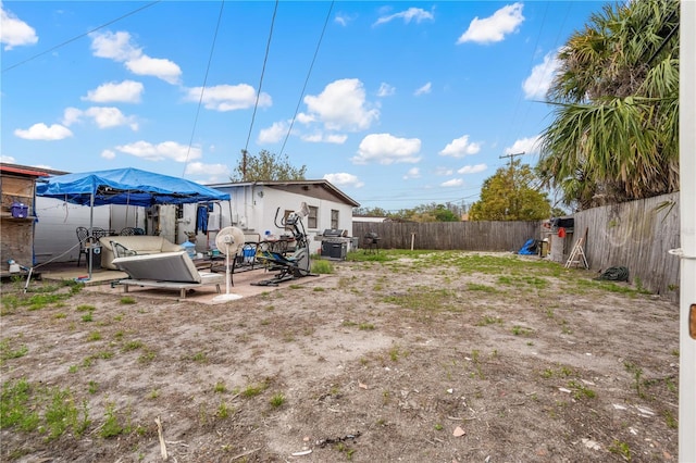 view of yard featuring a fenced backyard and a patio