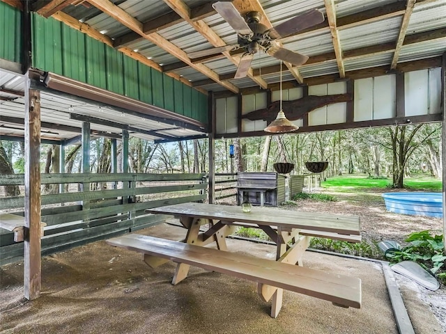 interior space with ceiling fan