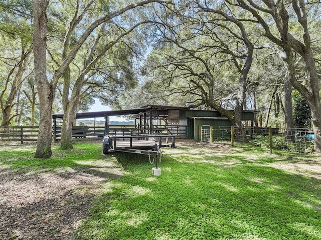 view of yard with an outdoor structure and an exterior structure