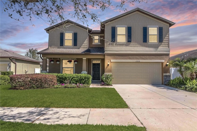 craftsman house featuring a yard, a garage, and driveway