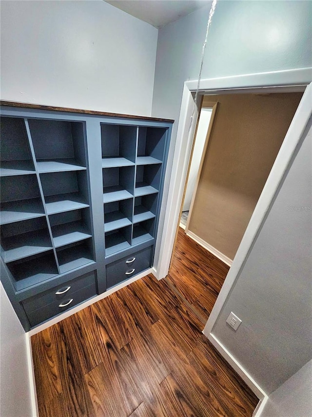 interior space featuring wood finished floors and baseboards