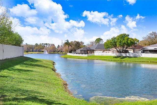 property view of water featuring fence