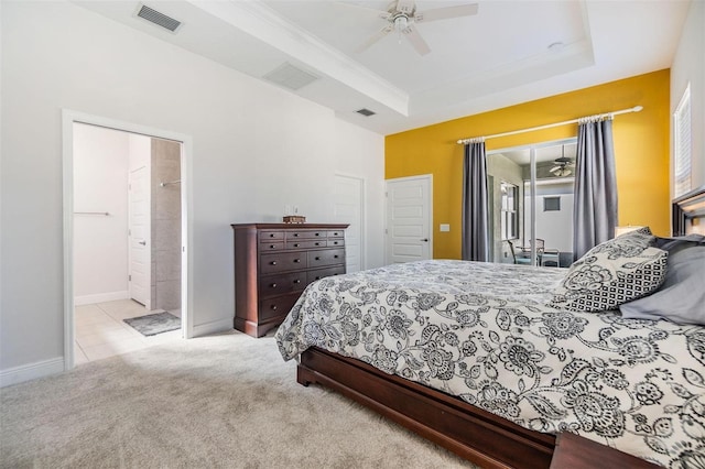 carpeted bedroom featuring access to outside, a raised ceiling, visible vents, and baseboards