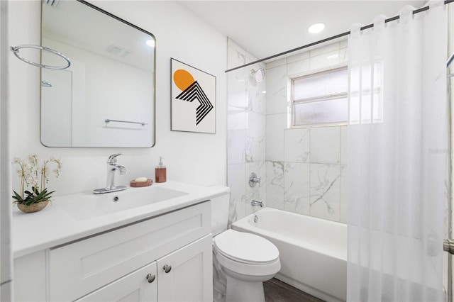 bathroom with toilet, shower / tub combo with curtain, and vanity