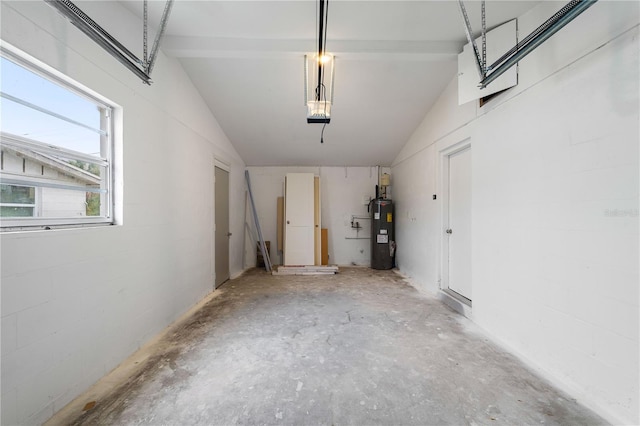 garage with a garage door opener and water heater