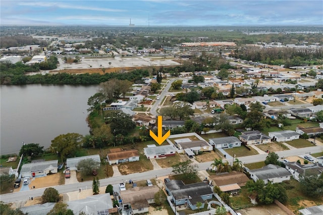 aerial view featuring a residential view and a water view