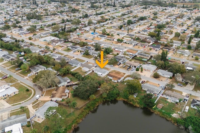 bird's eye view with a residential view and a water view