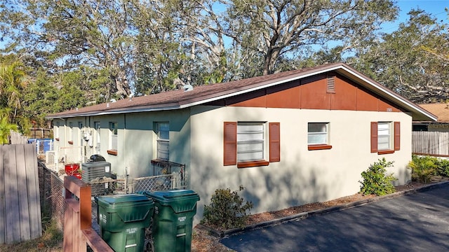 view of home's exterior featuring fence