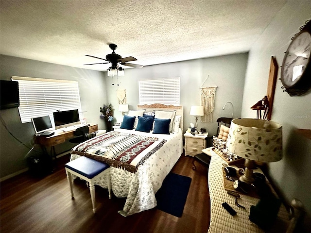 bedroom featuring ceiling fan, a textured ceiling, and wood finished floors