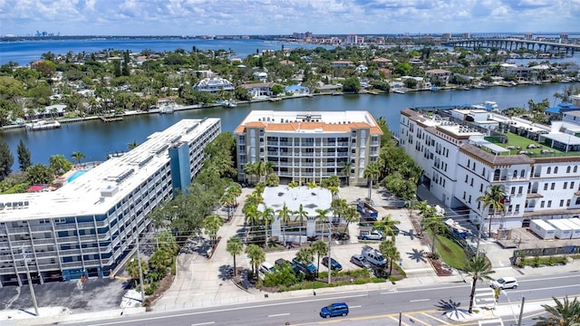 birds eye view of property with a water view and a city view